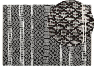 Kožený koberec 140 x 200 cm černý s béžovým FEHIMLI