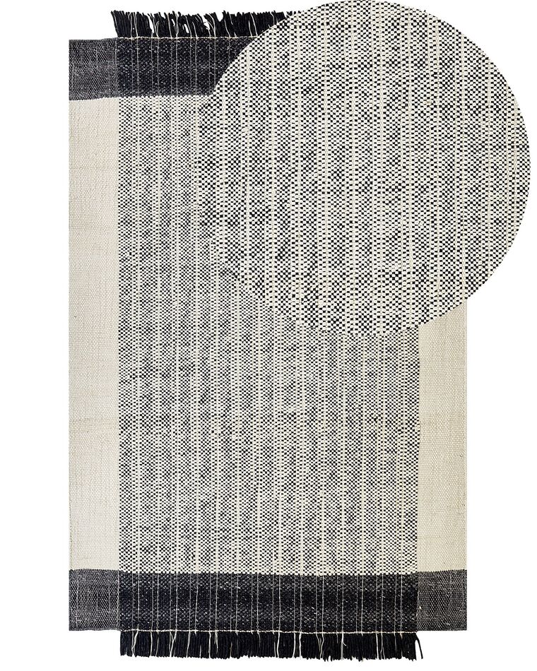 Teppich Wolle schwarz / cremeweiß 140 x 200 cm Kurzflor KETENLI_847444