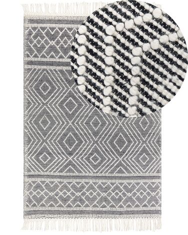 Teppich Wolle schwarz / weiß 160 x 230 cm Fransen Kurzflor SAVUCA