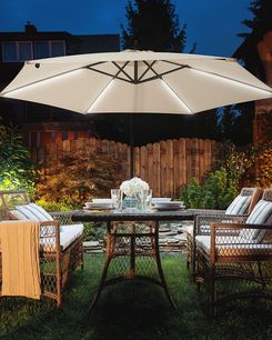 Riippuva aurinkovarjo LED-valoilla beige ⌀ 285 cm CORVAL Riippuva aurinkovarjo LED-valoilla beige ⌀ 285 cm CORVAL