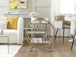 Kultainen tarjoiluvaunu lasitasolla COLTON