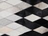 Kožený koberec 140 x 200 cm biela/čierna/béžová MALDAN_742849