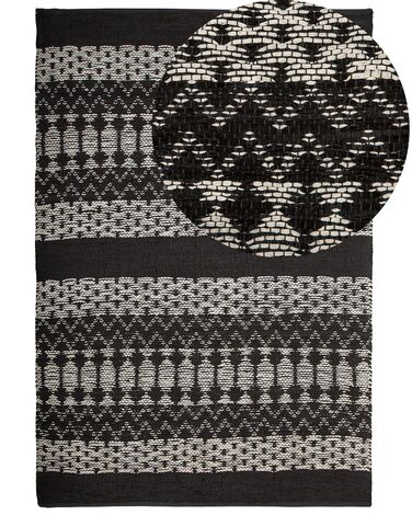 Kožený koberec 140 x 200 cm čierna/béžová SOKUN