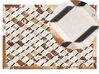 Kožený koberec 140 x 200 cm hnedá/béžová SERINOVA_780612