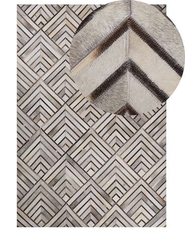 Teppich Kuhfell beige-grau 140 x 200 cm geometrisches Muster Kurzflor TEKIR