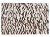 Tappeto pelle bovina marrone / bianco patchwork 140 x 200 cm AKYELE_780756
