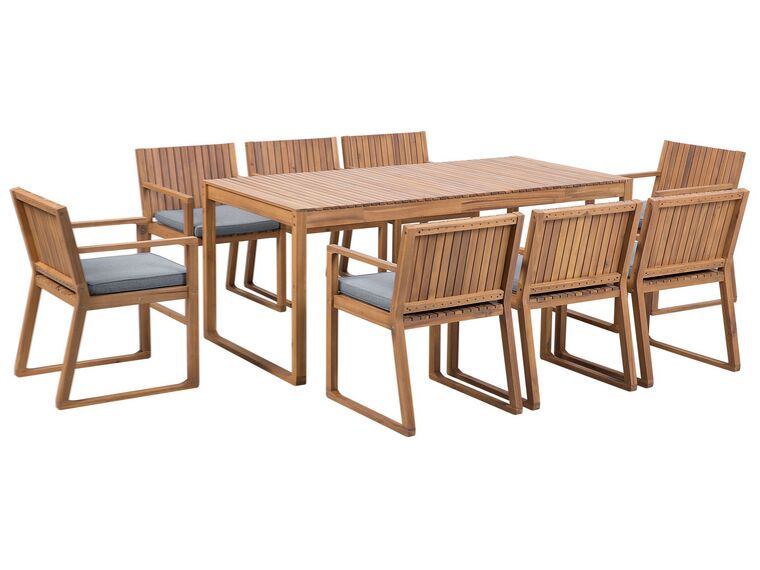Trädgårdsmöbelset av bord och 8 stolar med dyna i blå SASSARI_746063