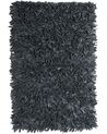 Fekete bőr hosszú szálú szőnyeg 140 x 200 cm MUT_848776