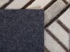 Béžový kožený koberec  140 x 200 cm TEKIR_764778