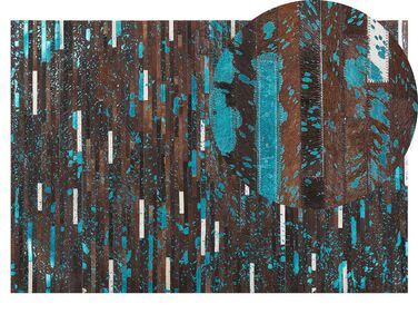 Kožený koberec 140 x 200 cm hnedá/modrá KISIR