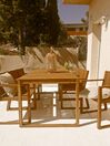 Trädgårdsmöbelset av bord och 8 stolar akaciaträ med dynor i marinblå SASSARI_827114