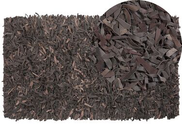 Kožený koberec 80 x 150 cm tmavohnedý MUT