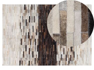 Kožený koberec 140 x 200 cm hnedá/béžová SINNELI