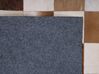 Kožený koberec hnědý s béžovou 140 x 200 cm SOLMAZ_758291