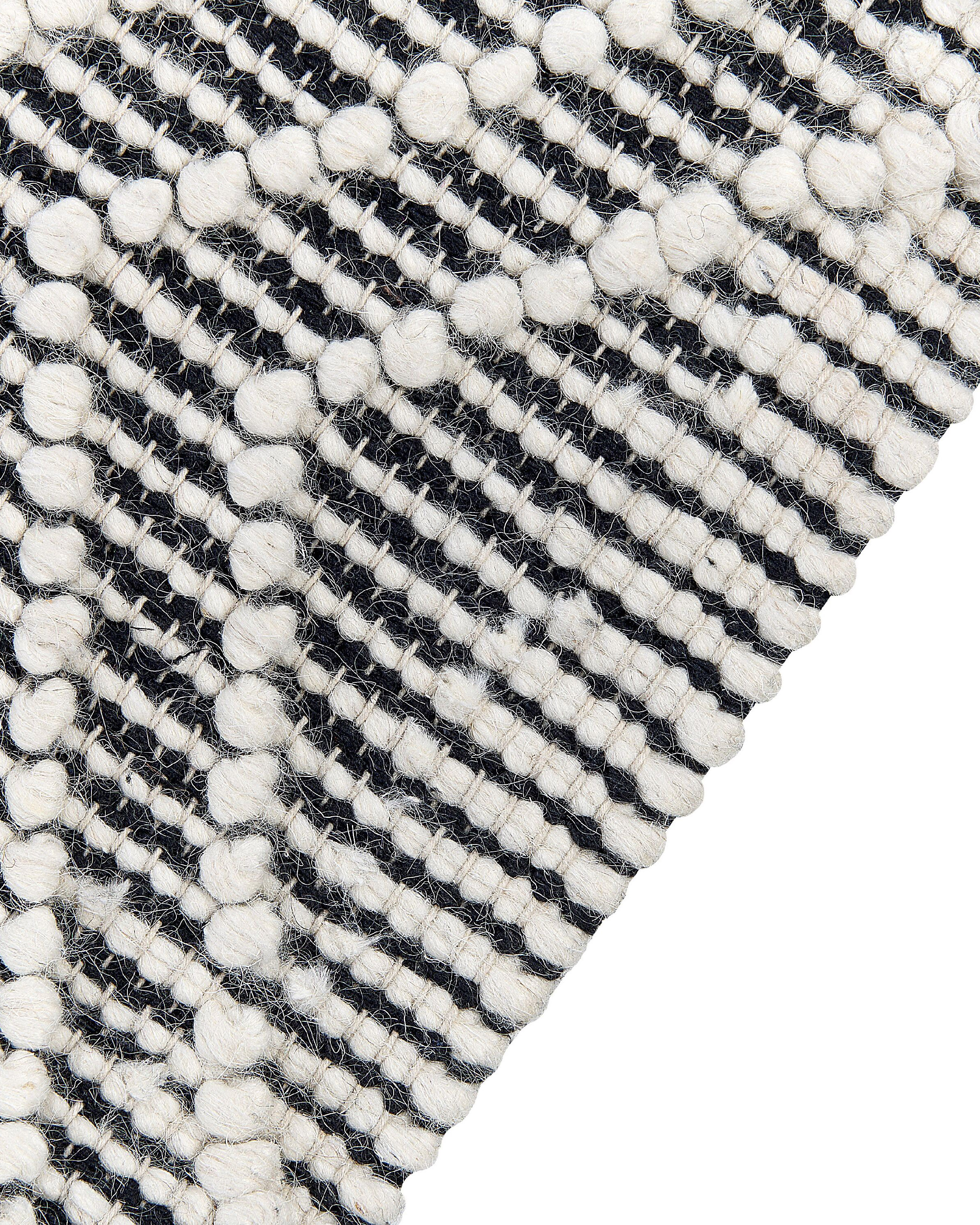 Teppich Wolle schwarz / weiß 160 x 230 cm Fransen Kurzflor SAVUCA_856512
