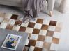 Kožený koberec hnědý s béžovou 140 x 200 cm SOLMAZ_758277