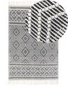 Teppich Wolle schwarz / weiß 160 x 230 cm Fransen Kurzflor SAVUCA_856510