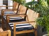 Trädgårdsmöbelset av bord och 8 stolar akaciaträ med dynor i marinblå SASSARI_774924