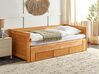 Drevená rozkladacia posteľ s úložným priestorom 90/180x200 cm svetlé drevo CAHORS_912559