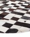Tapis rond patchwork en cuir noir et blanc BERGAMA_491727