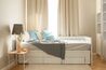 Rozkádací postel dřevěná bílá s roštem 90 x 200 cm CAHORS_831888
