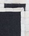 Tapis noir et crème en peau de vache 160 x 230 cm BOLU_212685