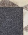 Kožený koberec béžovo-hnědý 140 x 200 cm SESLICE _780549