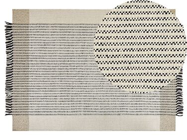 Teppich Wolle beige / schwarz 140 x 200 cm Kurzflor DIVARLI