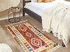 Vlněný kelimový koberec 80 x 150 cm vícebarevný OSHAKAN_859513