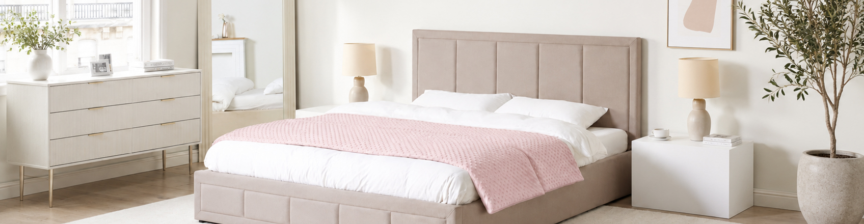 image showing bed arrangement with the focus on the weighted blanket