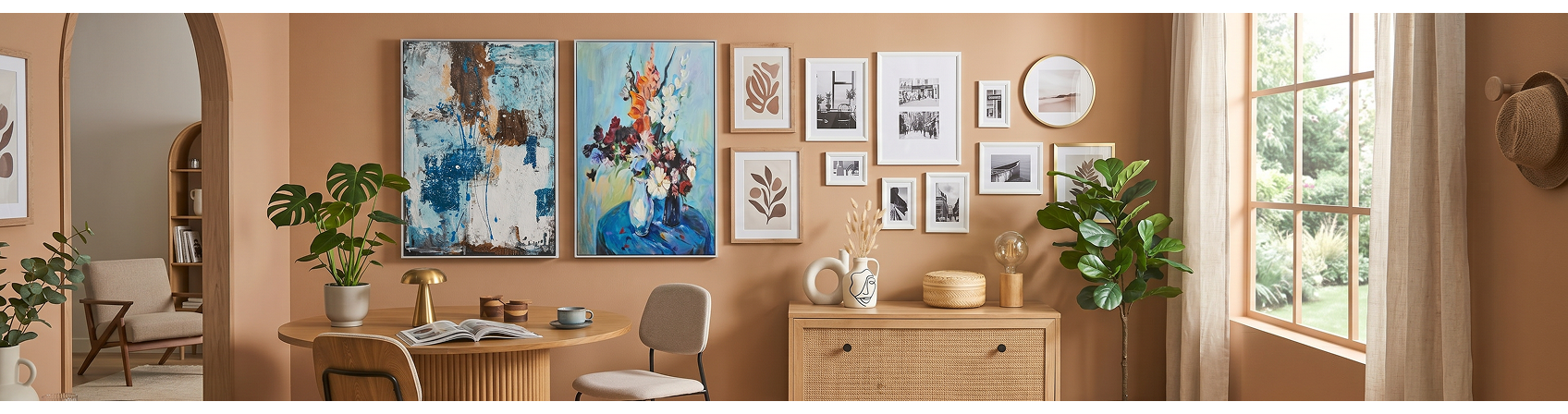 A picture of a living area with wall art on full display, showcasing paintings and framed photographs.