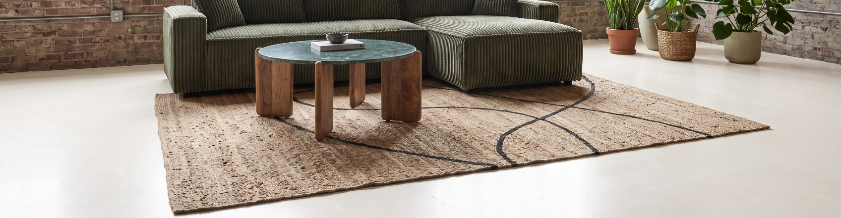 modern living room with jute rug in center