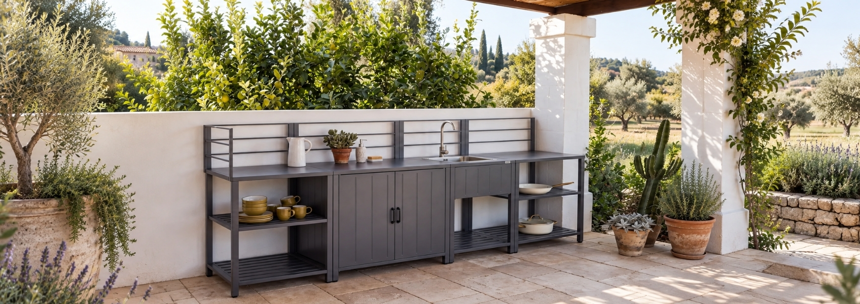 Outdoor setting with a modular garden kitchen, with a man standing next to it