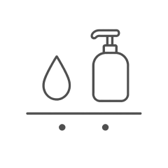 Water drop next to a bottle of mild soap